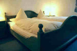 Gemütliche Ferienwohnung - Schlafzimmer mit Doppelbett